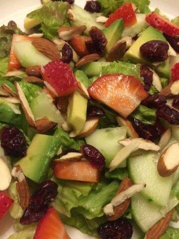 berry bright salad with cucumbers, strawberries, avocado, craisins, almonds
