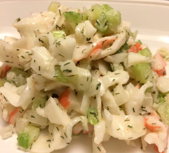 crab salad scooped onto white plate