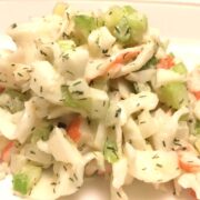 crab salad scooped onto a white plate
