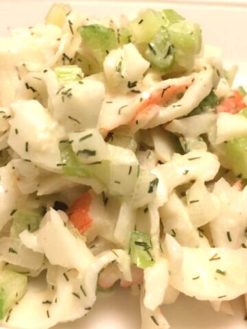 crab salad scooped onto a white plate