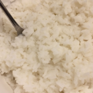 white rice with metal spoon
