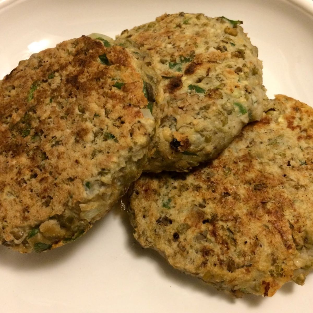 3 mung bean burgers on white plate