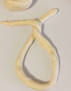 First twist forming the pretzel
