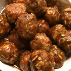 honey bbq meatballs stacked in white bowl