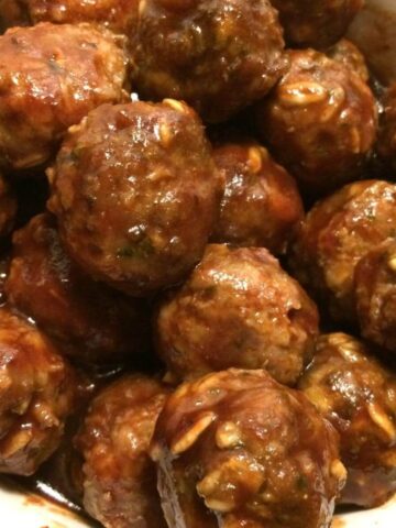 honey bbq meatballs stacked in white bowl