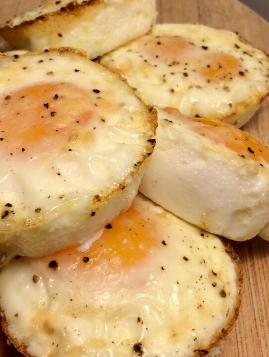 muffin tin eggs on cutting board