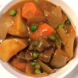 Dutch oven beef stew in white bowl