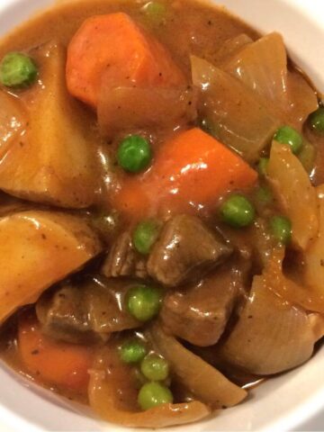 Dutch oven beef stew in white bowl