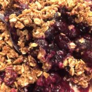 blueberry crisp close up with spoon