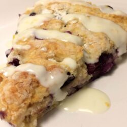 blueberry lavender scone with drizzle on plate