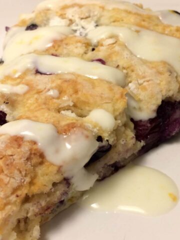 blueberry lavender scone with drizzle on plate