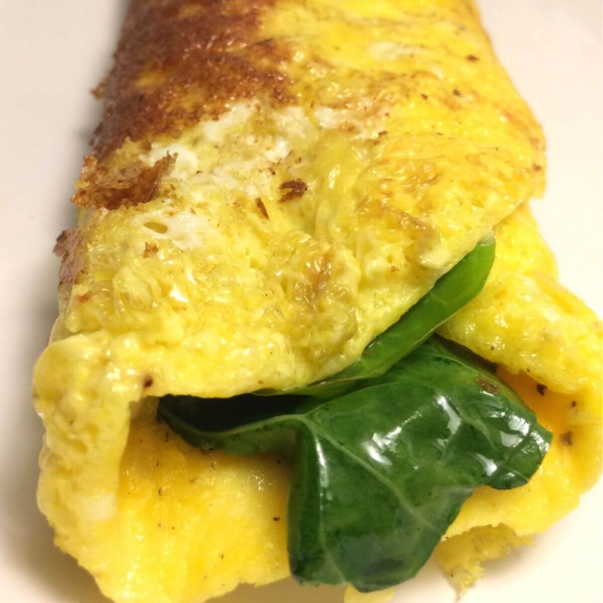 https://gardentogriddle.com/wp-content/uploads/2022/02/cheesy-greens-omelet-1200-1200.jpg