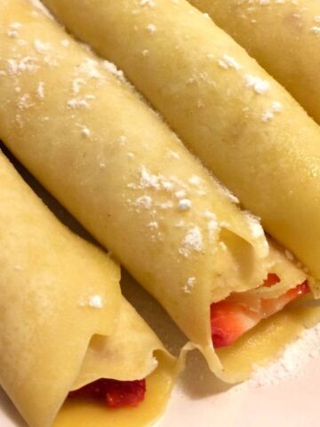 basic crepes rolled with strawberries inside