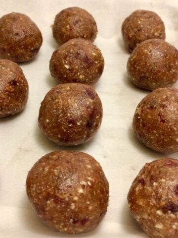 date balls in rows on parchment paper