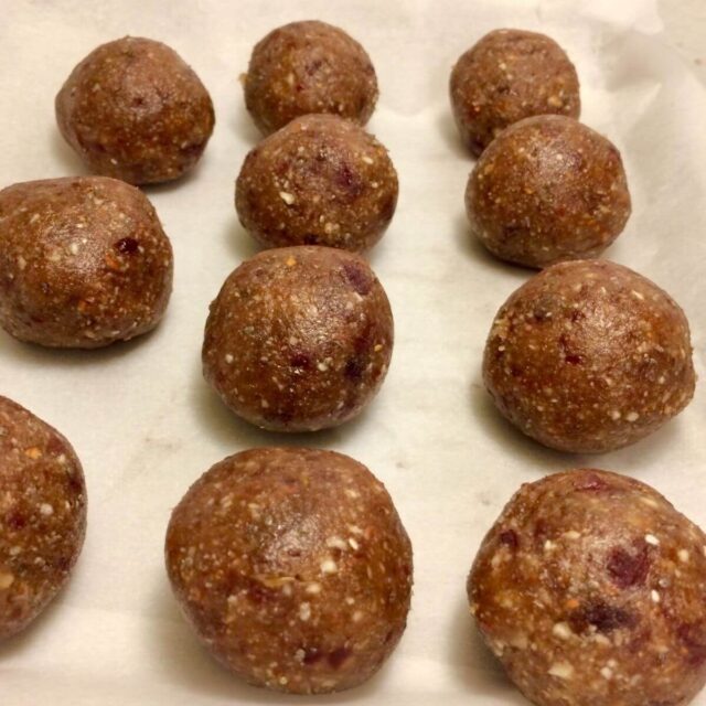 date balls in rows on parchment paper