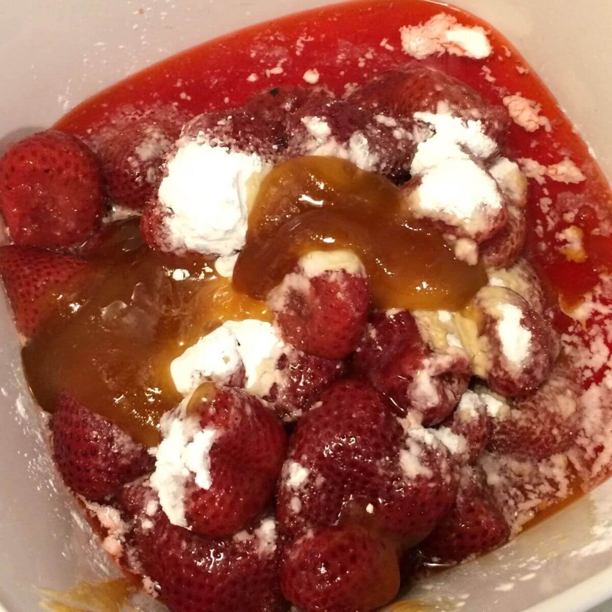 strawberry filling ingredients in a Corning Ware pot