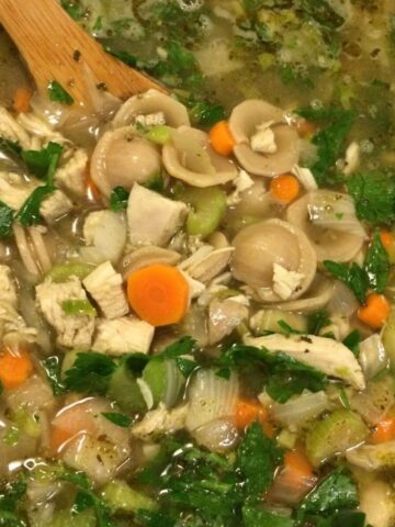 chicken noodle soup with wooden spoon