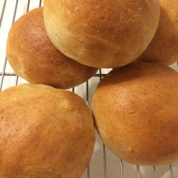 dinner rolls overlapping on cooling rack