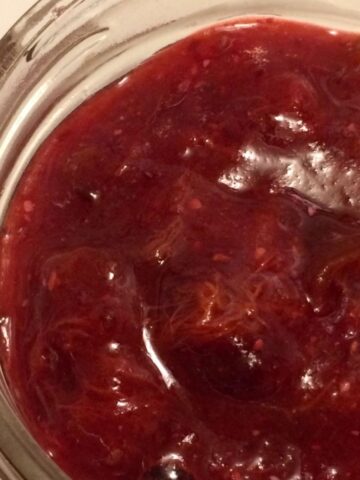 naturally sweetened plum jam in mason jar close up