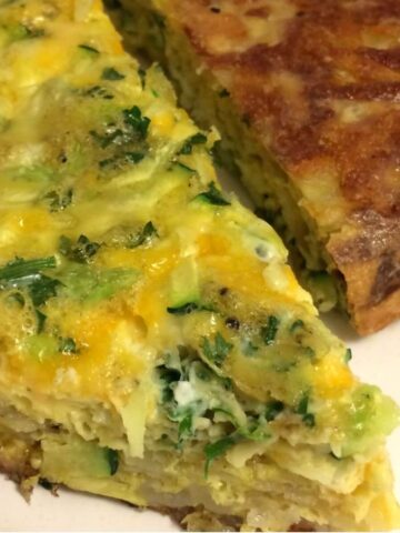 egg frittata face up and face down with hash brown bottoms showing