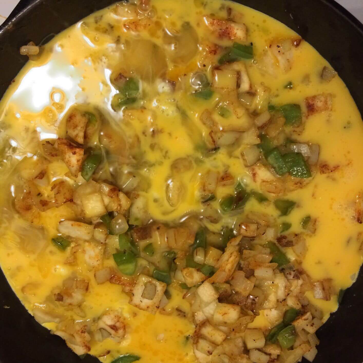 breakfast burrito skillet with eggs added in cast iron