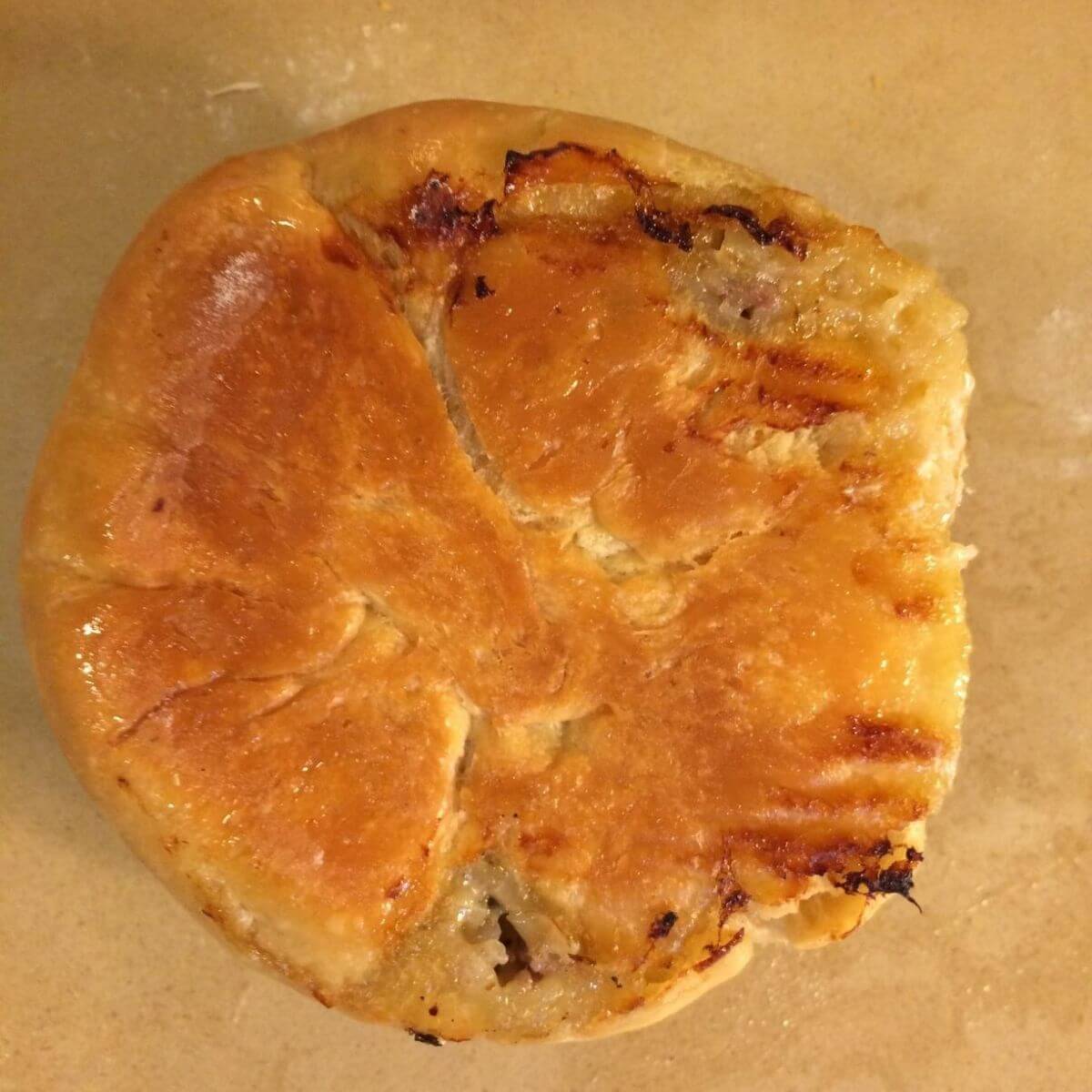 golden brown underside of baked kraut burger