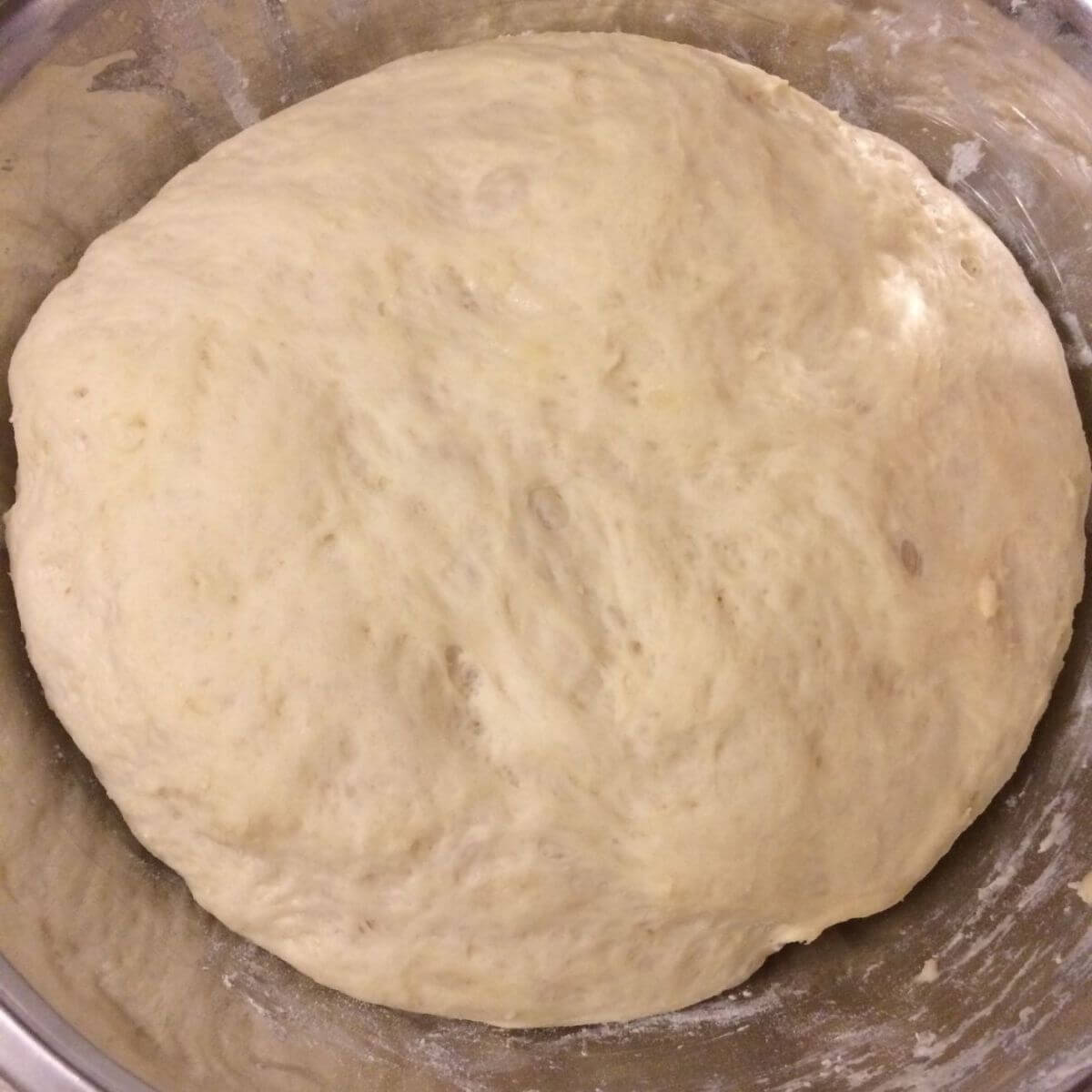 kraut burger dough in a stainless steel bowl