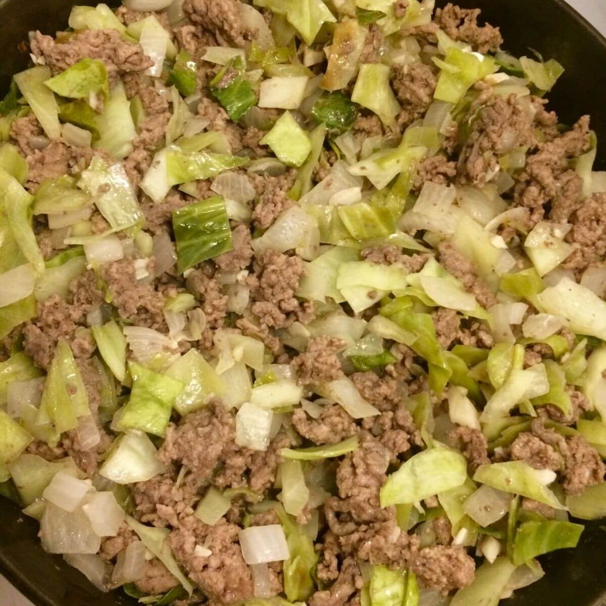 kraut burger filling cooked in cast iron skillet
