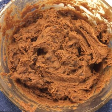 double chocolate chip cookie dough in glass bowl close up image