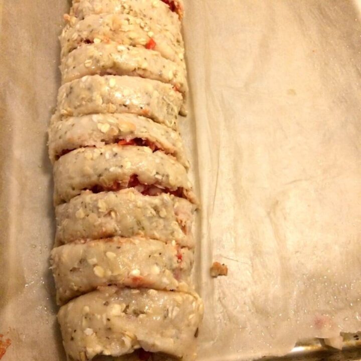 Meat roll on parchment paper cut into 8 slices.