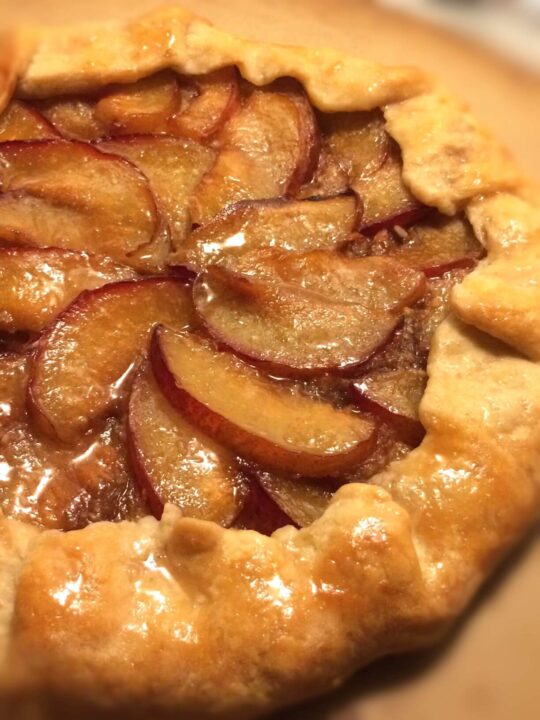 up close baked rustic plum tart