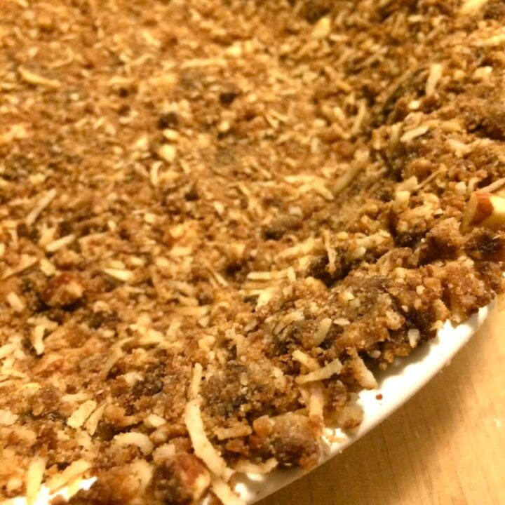 Baked nut crust with shredded coconut for maple pumpkin pie.